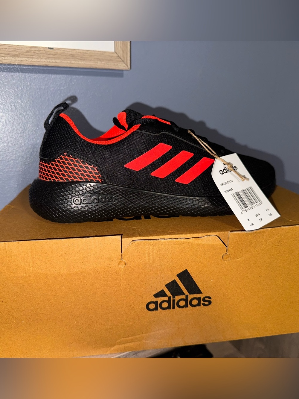 adidas men's  6.5 Black Sneakers with Red Accents